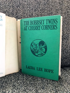 "THE BOBBSEY TWINS AT CHERRY CORNERS" (VINTAGE 1927 BOOK, WITH RARE, INTACT BOOK JACKET)