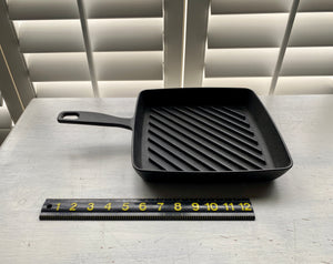 HEAVY-DUTY, BLACK CAST IRON GRILL PAN:  SQUARE-SHAPED, PRE-SEASONED, AND A BIG BARGAIN