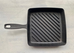 HEAVY-DUTY, BLACK CAST IRON GRILL PAN:  SQUARE-SHAPED, PRE-SEASONED, AND A BIG BARGAIN