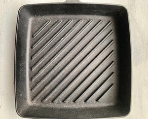 HEAVY-DUTY, BLACK CAST IRON GRILL PAN:  SQUARE-SHAPED, PRE-SEASONED, AND A BIG BARGAIN