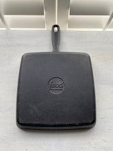 HEAVY-DUTY, BLACK CAST IRON GRILL PAN:  SQUARE-SHAPED, PRE-SEASONED, AND A BIG BARGAIN