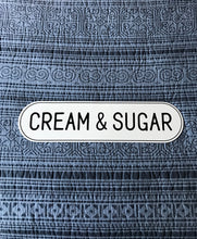 CHARMING, OVAL-EDGED TIN "CREAM & SUGAR" WALL SIGN