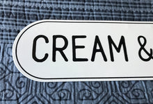 CHARMING, OVAL-EDGED TIN "CREAM & SUGAR" WALL SIGN