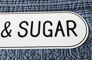 CHARMING, OVAL-EDGED TIN "CREAM & SUGAR" WALL SIGN