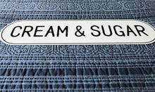 CHARMING, OVAL-EDGED TIN "CREAM & SUGAR" WALL SIGN