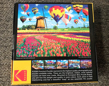 550-PIECE ROMANTIC WINDMILL, HOT AIR BALLOONS, AND TULIPS PUZZLE