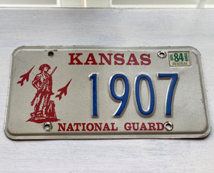 VINTAGE LICENSE PLATE:  1984 KANSAS (STICKER)--RARE/SPECIAL RED, BLUE, AND CREAM NATIONAL GUARD PLATE