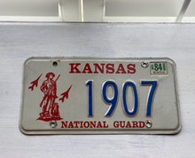 VINTAGE LICENSE PLATE:  1984 KANSAS (STICKER)--RARE/SPECIAL RED, BLUE, AND CREAM NATIONAL GUARD PLATE