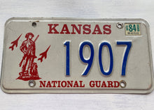 VINTAGE LICENSE PLATE:  1984 KANSAS (STICKER)--RARE/SPECIAL RED, BLUE, AND CREAM NATIONAL GUARD PLATE