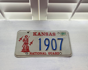 VINTAGE LICENSE PLATE:  1984 KANSAS (STICKER)--RARE/SPECIAL RED, BLUE, AND CREAM NATIONAL GUARD PLATE