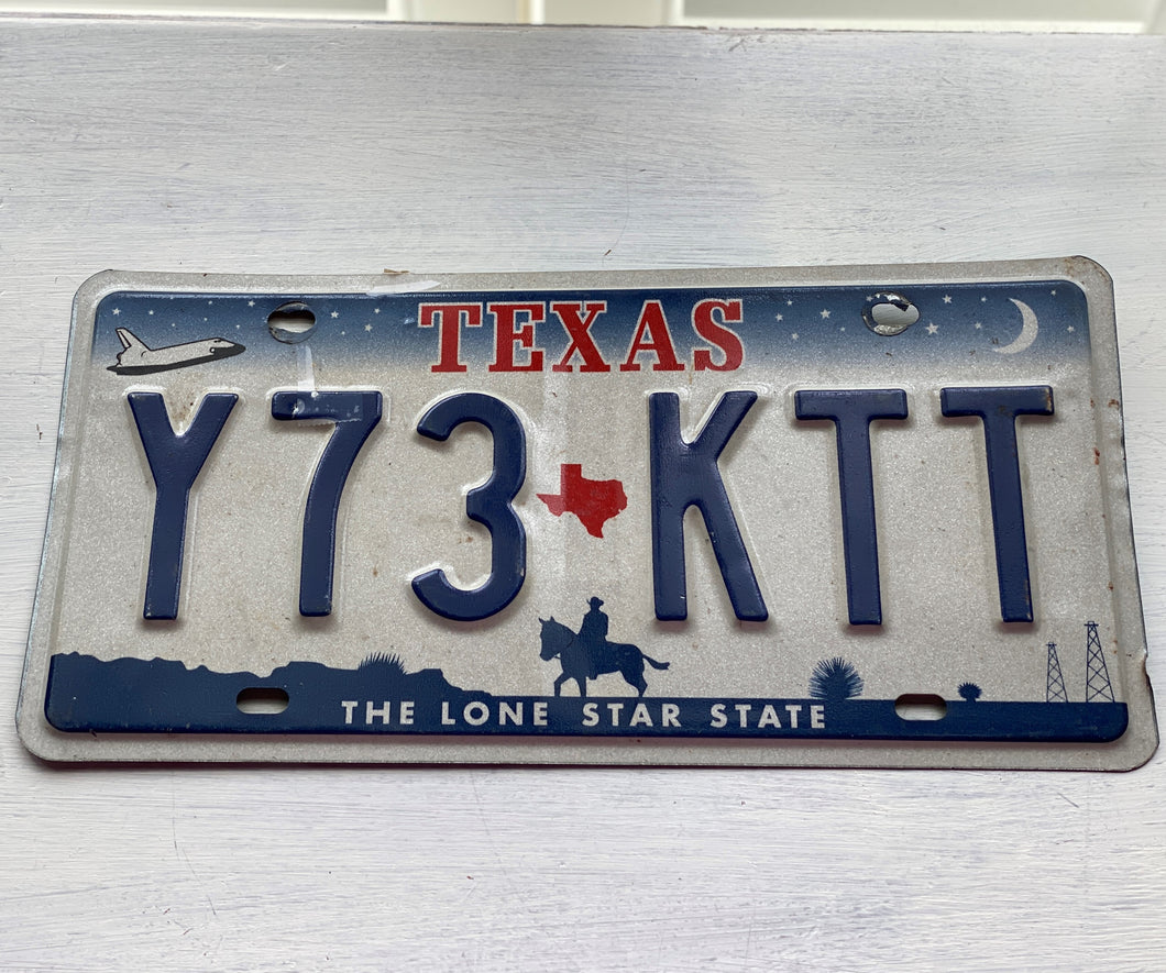 VINTAGE LICENSE PLATE:  TEXAS CLASSIC SYMBOLS PLATE--FROM NASA TO COWBOY AND HORSE TO OIL RIGS