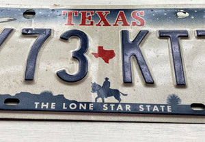 VINTAGE LICENSE PLATE:  TEXAS CLASSIC SYMBOLS PLATE--FROM NASA TO COWBOY AND HORSE TO OIL RIGS