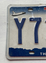 VINTAGE LICENSE PLATE:  TEXAS CLASSIC SYMBOLS PLATE--FROM NASA TO COWBOY AND HORSE TO OIL RIGS