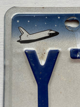 VINTAGE LICENSE PLATE:  TEXAS CLASSIC SYMBOLS PLATE--FROM NASA TO COWBOY AND HORSE TO OIL RIGS