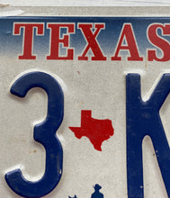 VINTAGE LICENSE PLATE:  TEXAS CLASSIC SYMBOLS PLATE--FROM NASA TO COWBOY AND HORSE TO OIL RIGS