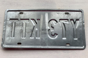 VINTAGE LICENSE PLATE:  TEXAS CLASSIC SYMBOLS PLATE--FROM NASA TO COWBOY AND HORSE TO OIL RIGS