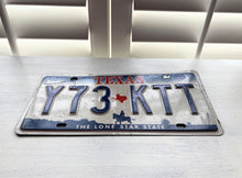 VINTAGE LICENSE PLATE:  TEXAS CLASSIC SYMBOLS PLATE--FROM NASA TO COWBOY AND HORSE TO OIL RIGS