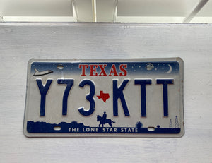 VINTAGE LICENSE PLATE:  TEXAS CLASSIC SYMBOLS PLATE--FROM NASA TO COWBOY AND HORSE TO OIL RIGS