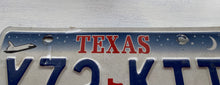 VINTAGE LICENSE PLATE:  TEXAS CLASSIC SYMBOLS PLATE--FROM NASA TO COWBOY AND HORSE TO OIL RIGS