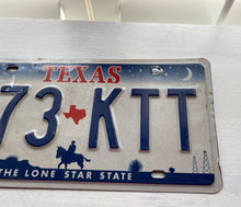 VINTAGE LICENSE PLATE:  TEXAS CLASSIC SYMBOLS PLATE--FROM NASA TO COWBOY AND HORSE TO OIL RIGS