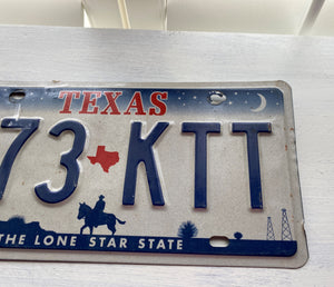 VINTAGE LICENSE PLATE:  TEXAS CLASSIC SYMBOLS PLATE--FROM NASA TO COWBOY AND HORSE TO OIL RIGS