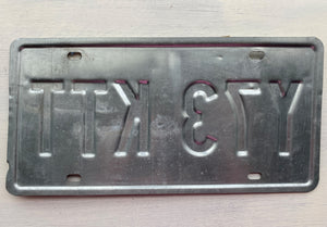 VINTAGE LICENSE PLATE:  TEXAS CLASSIC SYMBOLS PLATE--FROM NASA TO COWBOY AND HORSE TO OIL RIGS