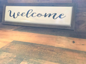 OLD-SCHOOL MEETS MODERN FARMHOUSE CHIC (PRETTY, PRETTY, PRETTY BLACK-AND-WHITE ENAMEL "WELCOME" WALL DECOR)